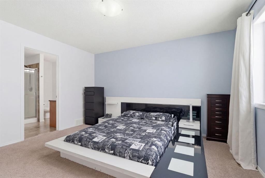 512 Panatella Square Nw, Calgary, AB - Indoor Photo Showing Bedroom
