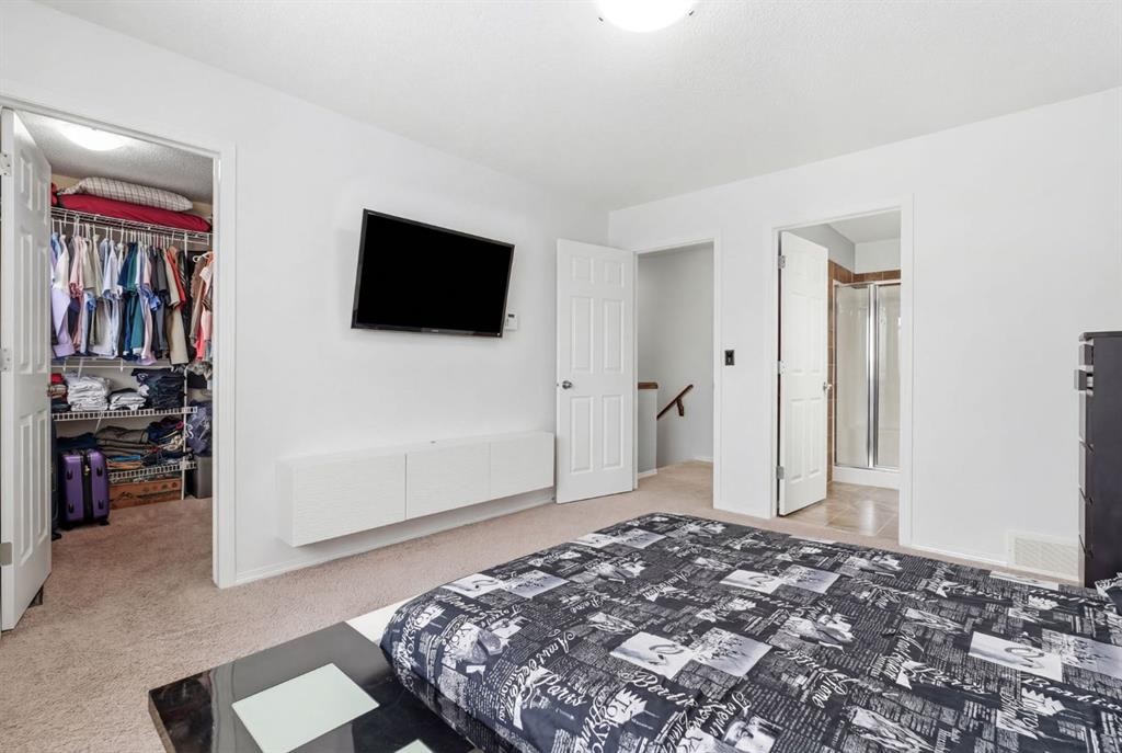 512 Panatella Square Nw, Calgary, AB - Indoor Photo Showing Bedroom