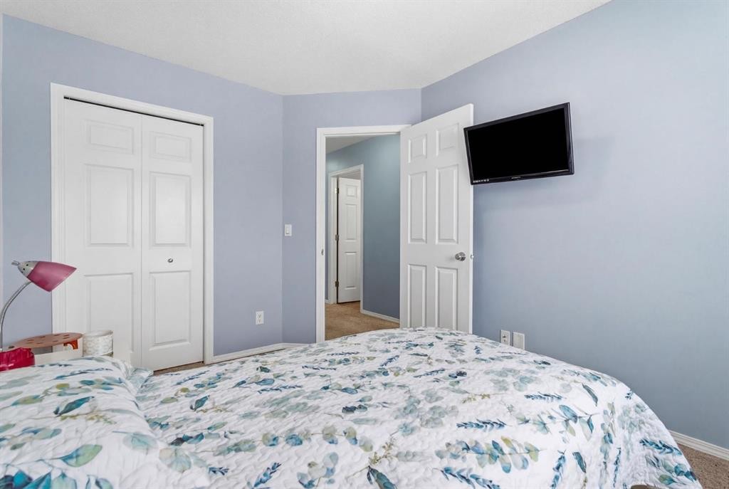 512 Panatella Square Nw, Calgary, AB - Indoor Photo Showing Bedroom