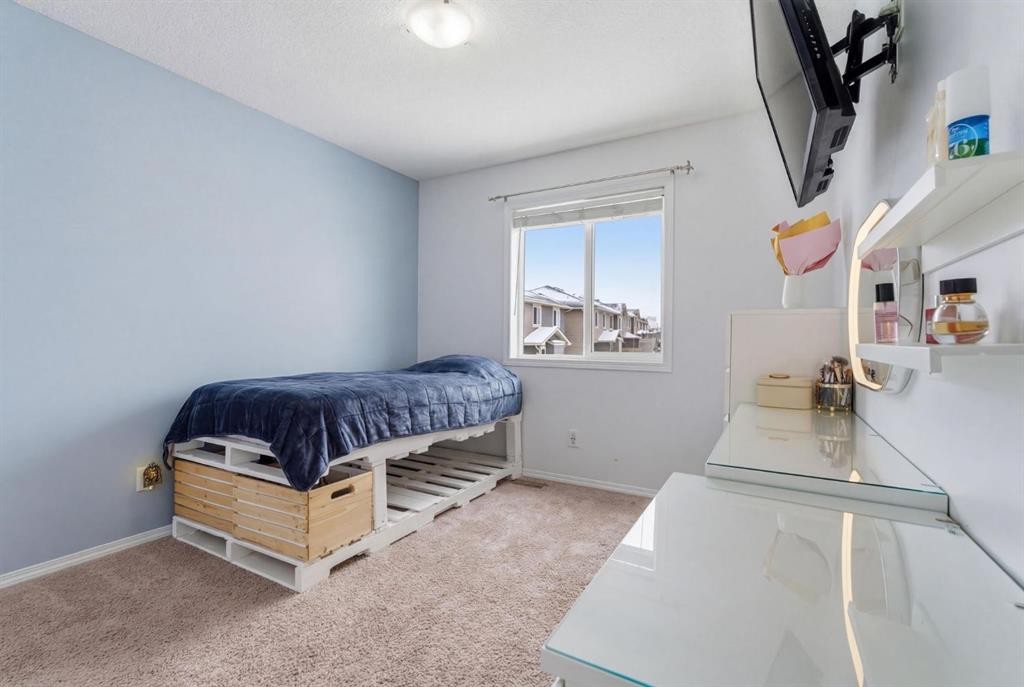 512 Panatella Square Nw, Calgary, AB - Indoor Photo Showing Bedroom