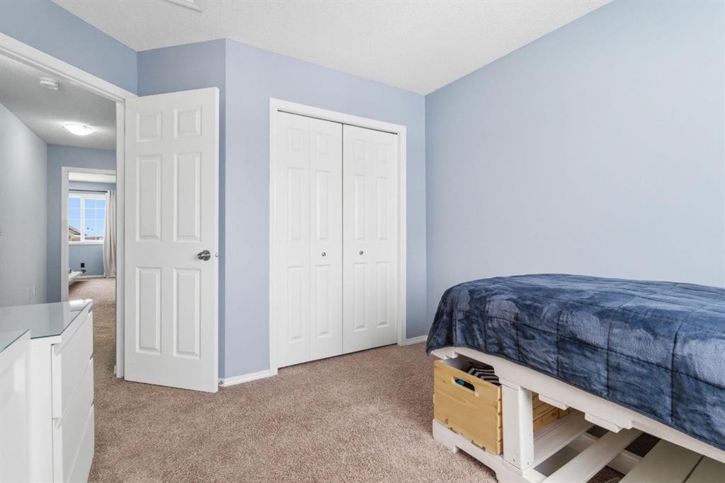 512 Panatella Square Nw, Calgary, AB - Indoor Photo Showing Bedroom