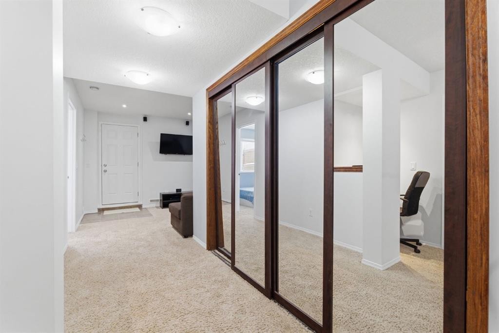 512 Panatella Square Nw, Calgary, AB - Indoor Photo Showing Other Room