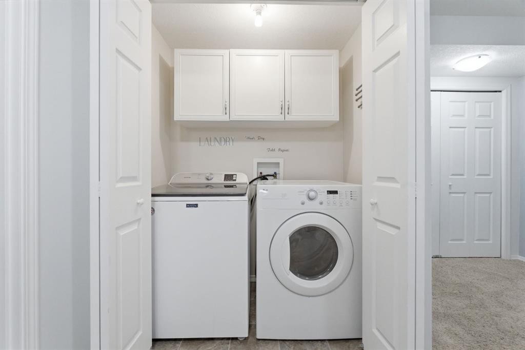 512 Panatella Square Nw, Calgary, AB - Indoor Photo Showing Laundry Room