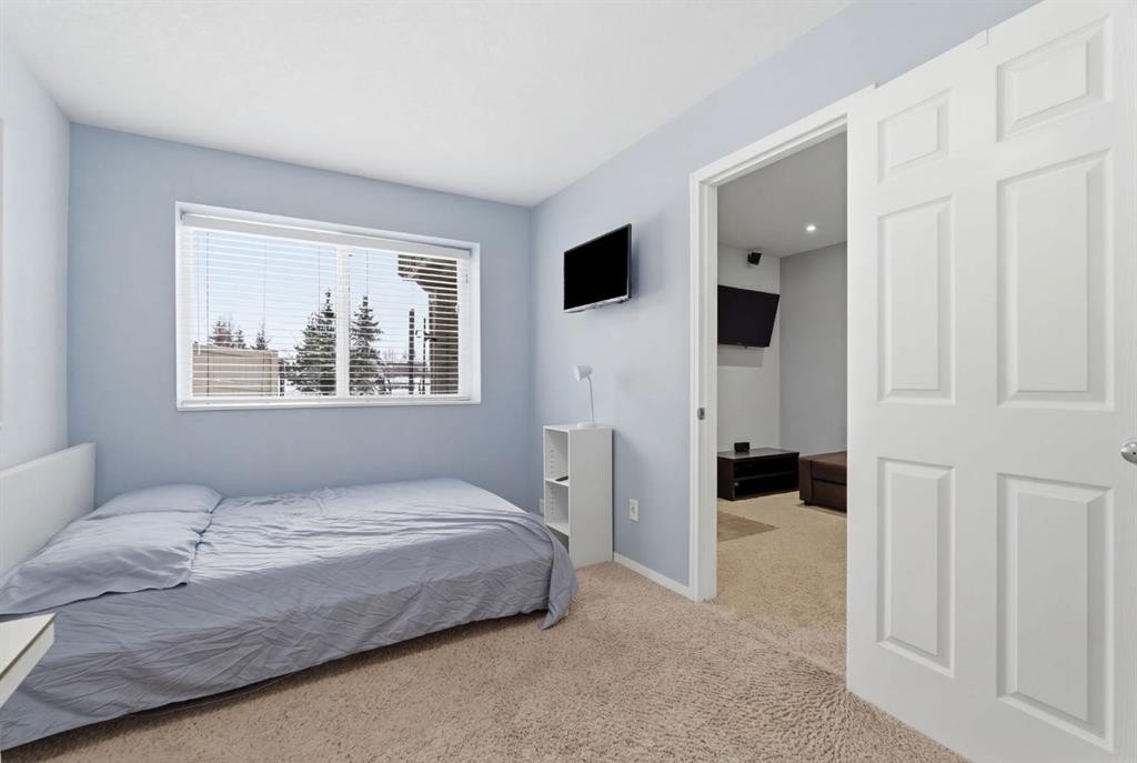 512 Panatella Square Nw, Calgary, AB - Indoor Photo Showing Bedroom