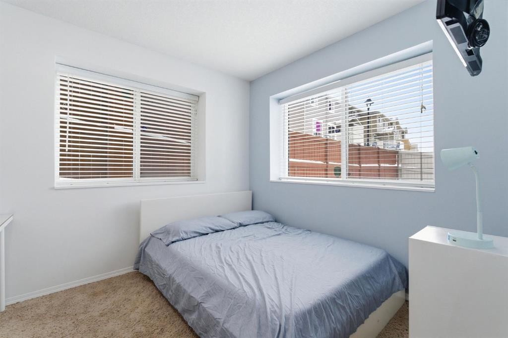 512 Panatella Square Nw, Calgary, AB - Indoor Photo Showing Bedroom