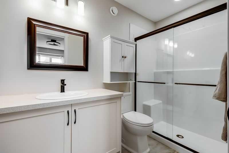 100 Langwell Common Se, Airdrie, AB - Indoor Photo Showing Bathroom