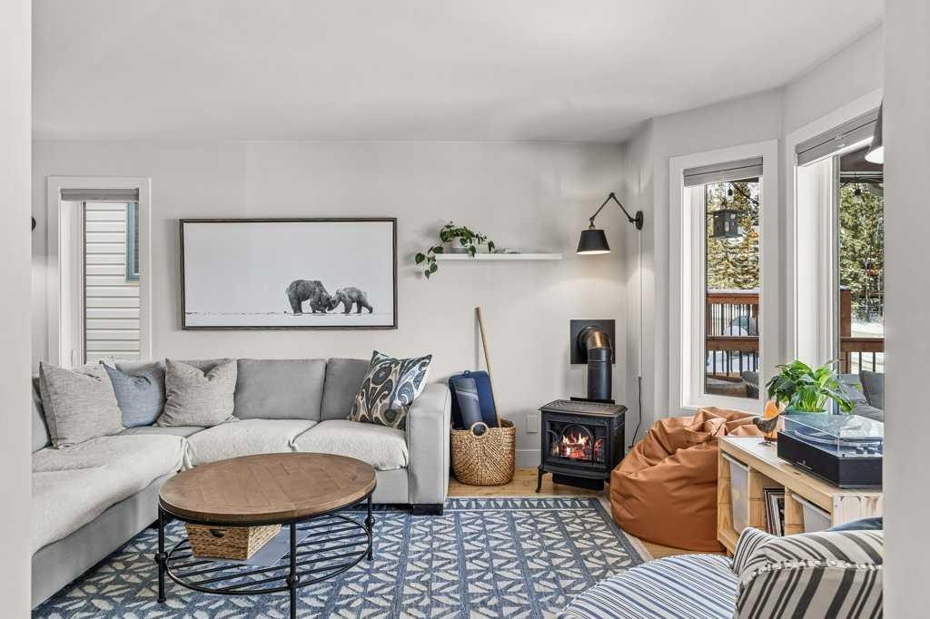 979 Wilson Way, Canmore, AB - Indoor Photo Showing Living Room With Fireplace