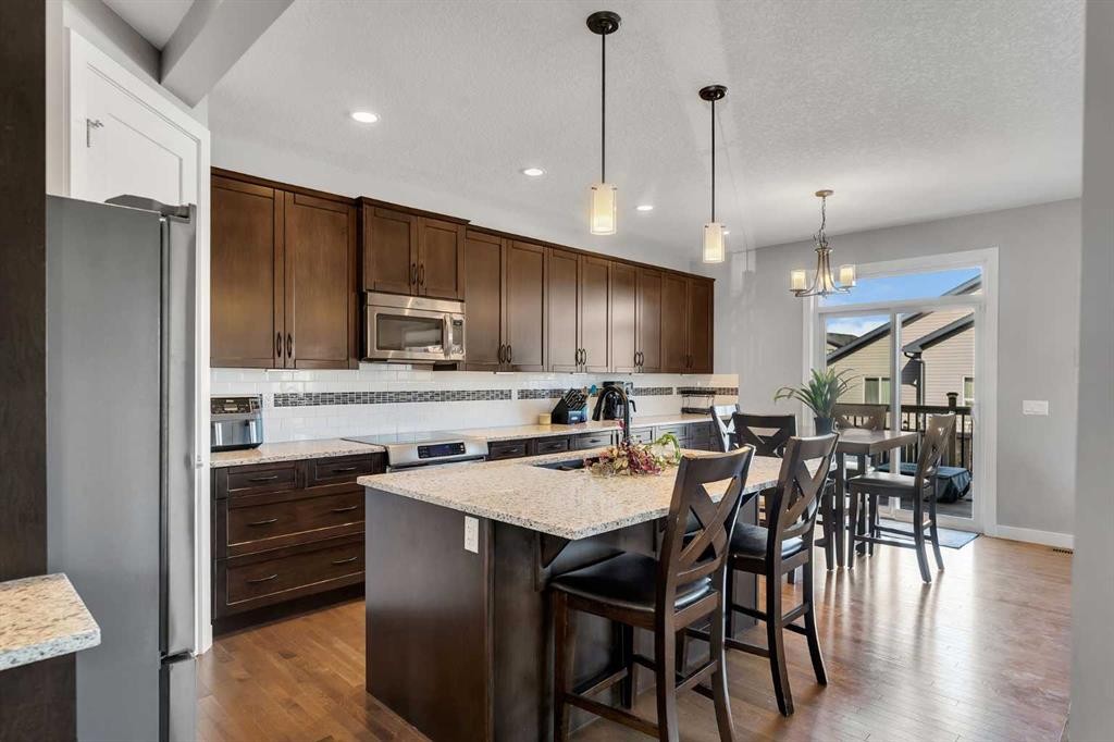 140 Rainbow Falls Heath, Chestermere, AB - Indoor Photo Showing Kitchen With Upgraded Kitchen