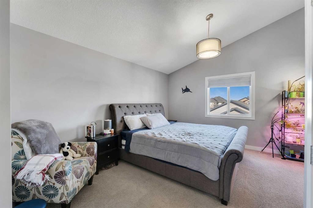 140 Rainbow Falls Heath, Chestermere, AB - Indoor Photo Showing Bedroom