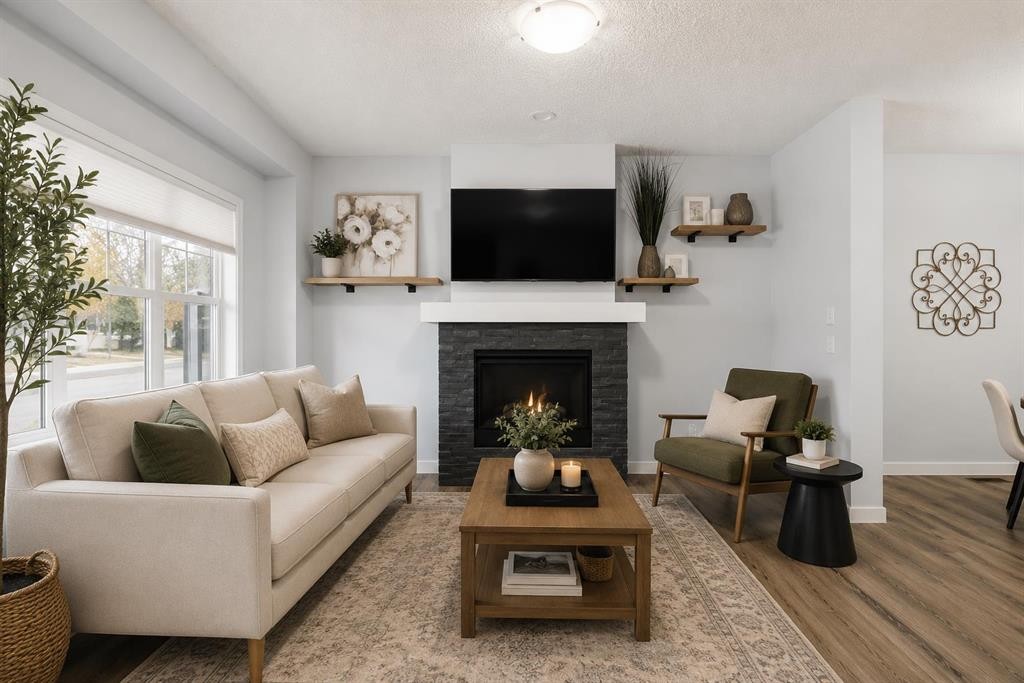 27 Masters Manor Se, Calgary, AB - Indoor Photo Showing Living Room With Fireplace