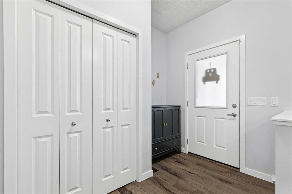 27 Masters Manor Se, Calgary, AB - Indoor Photo Showing Dining Room With Fireplace