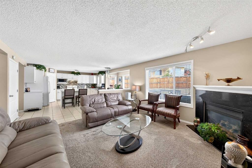 238 Royal Birch View Nw, Calgary, AB - Indoor Photo Showing Living Room With Fireplace