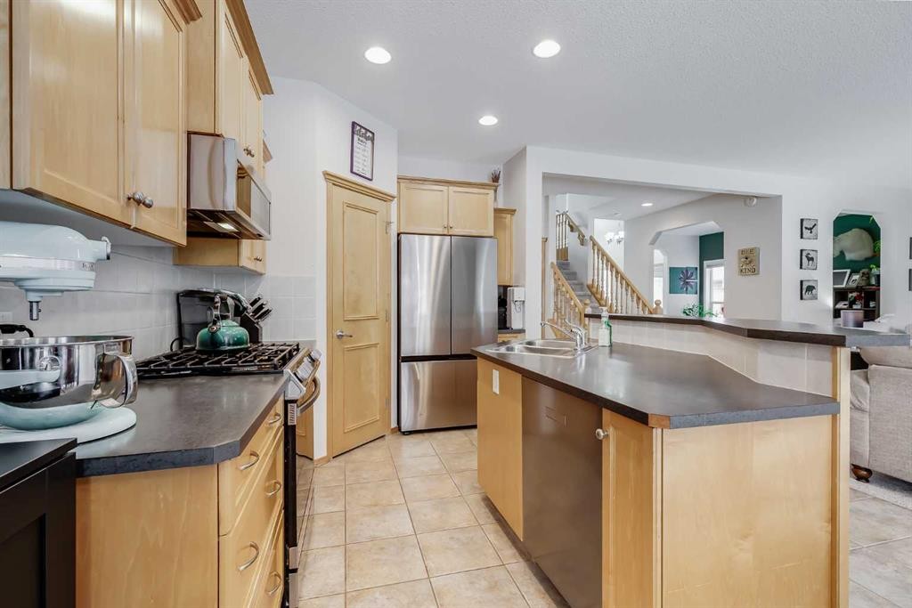 96 Chapala Square Se, Calgary, AB - Indoor Photo Showing Kitchen With Double Sink