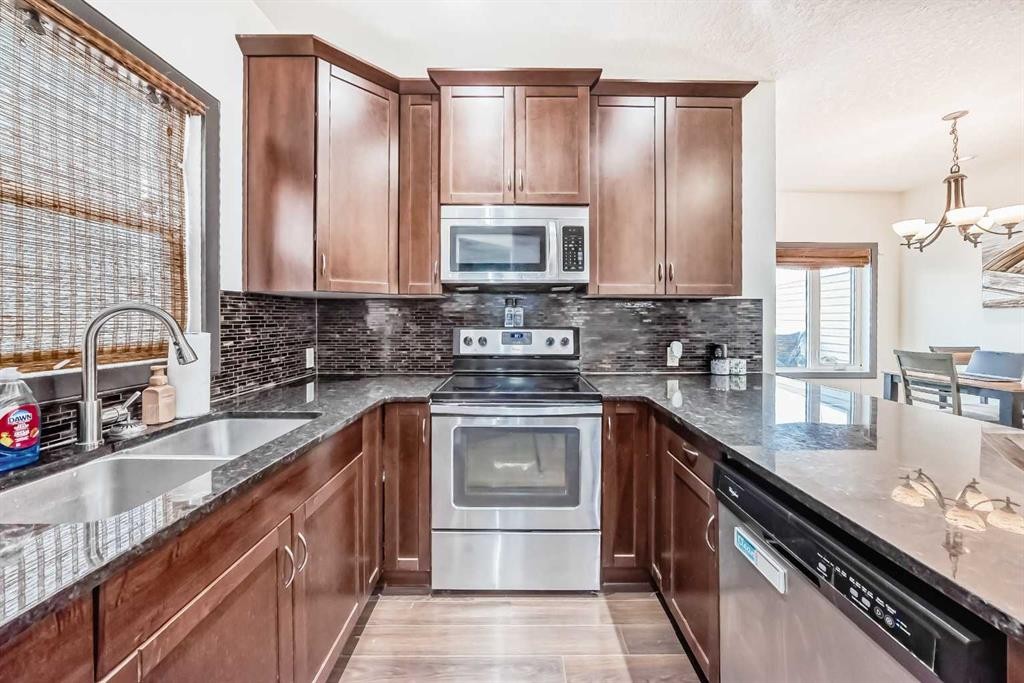 17 Redstone Common Ne, Calgary, AB - Indoor Photo Showing Kitchen With Stainless Steel Kitchen With Double Sink With Upgraded Kitchen