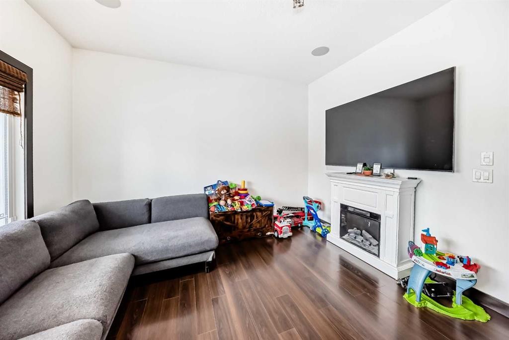17 Redstone Common Ne, Calgary, AB - Indoor Photo Showing Living Room With Fireplace