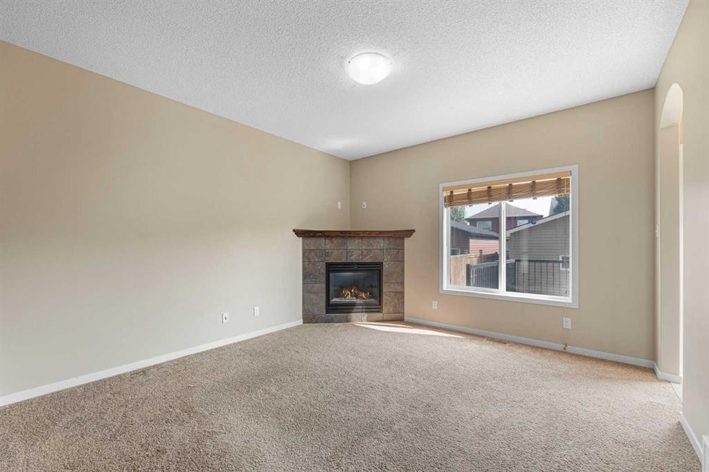 46 Autumn Crescent Se, Calgary, AB - Indoor Photo Showing Living Room With Fireplace