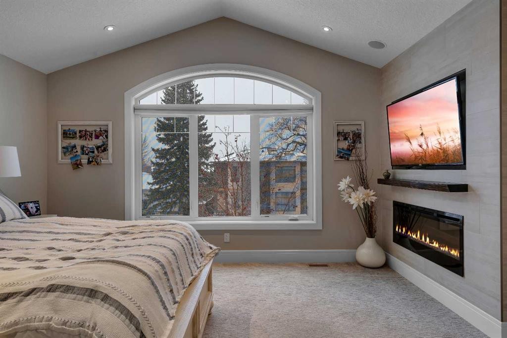 2041 45 Avenue Sw, Calgary, AB - Indoor Photo Showing Bedroom With Fireplace