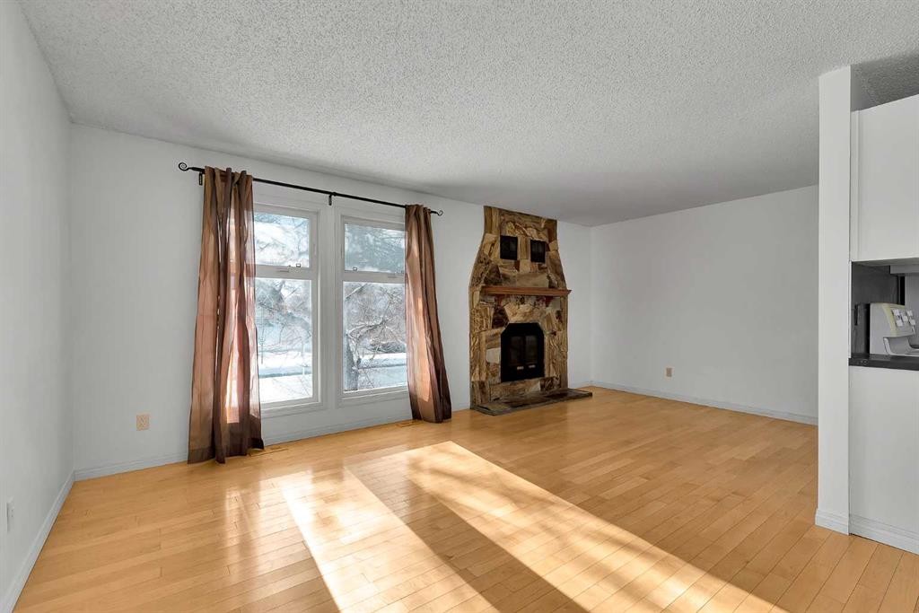 295 Edgepark Boulevard Nw, Calgary, AB - Indoor Photo Showing Living Room With Fireplace