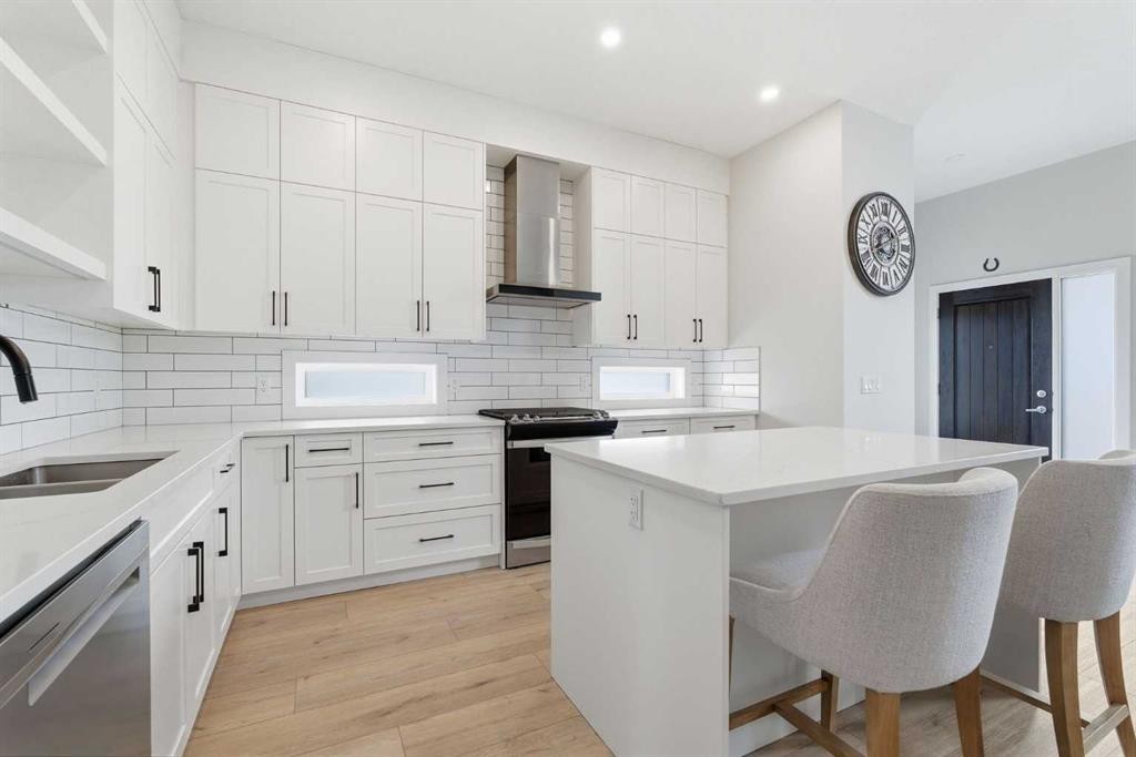 56 Iris Crescent, Okotoks, AB - Indoor Photo Showing Kitchen With Double Sink With Upgraded Kitchen