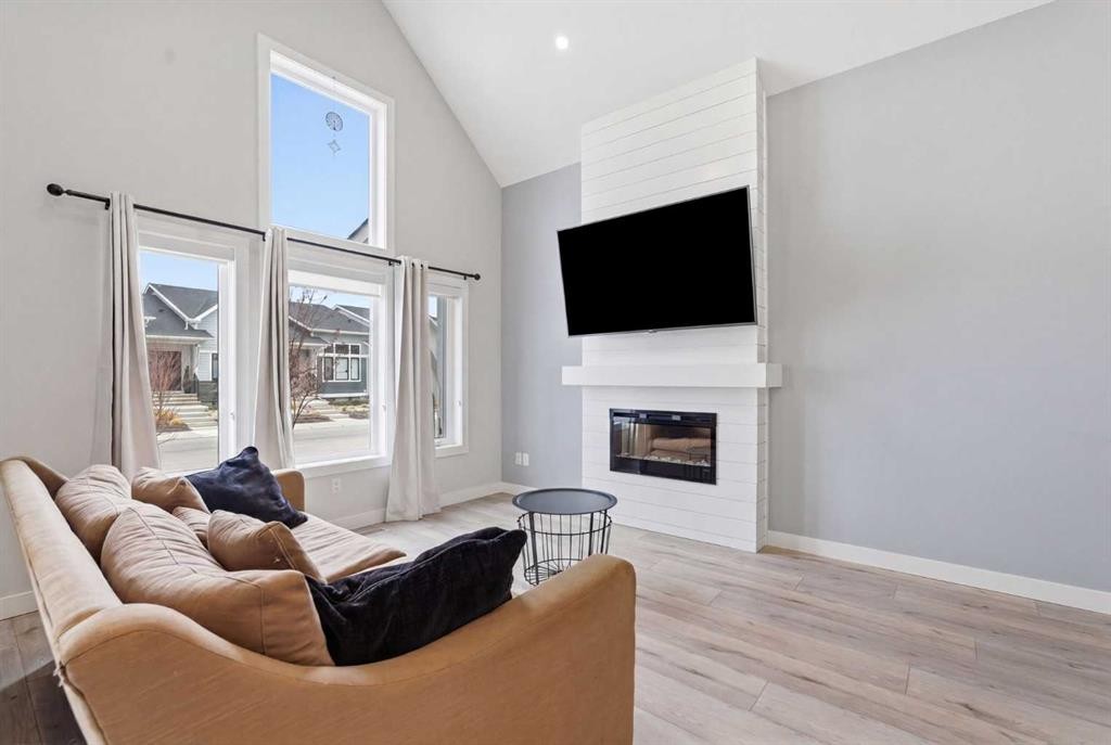 56 Iris Crescent, Okotoks, AB - Indoor Photo Showing Living Room With Fireplace