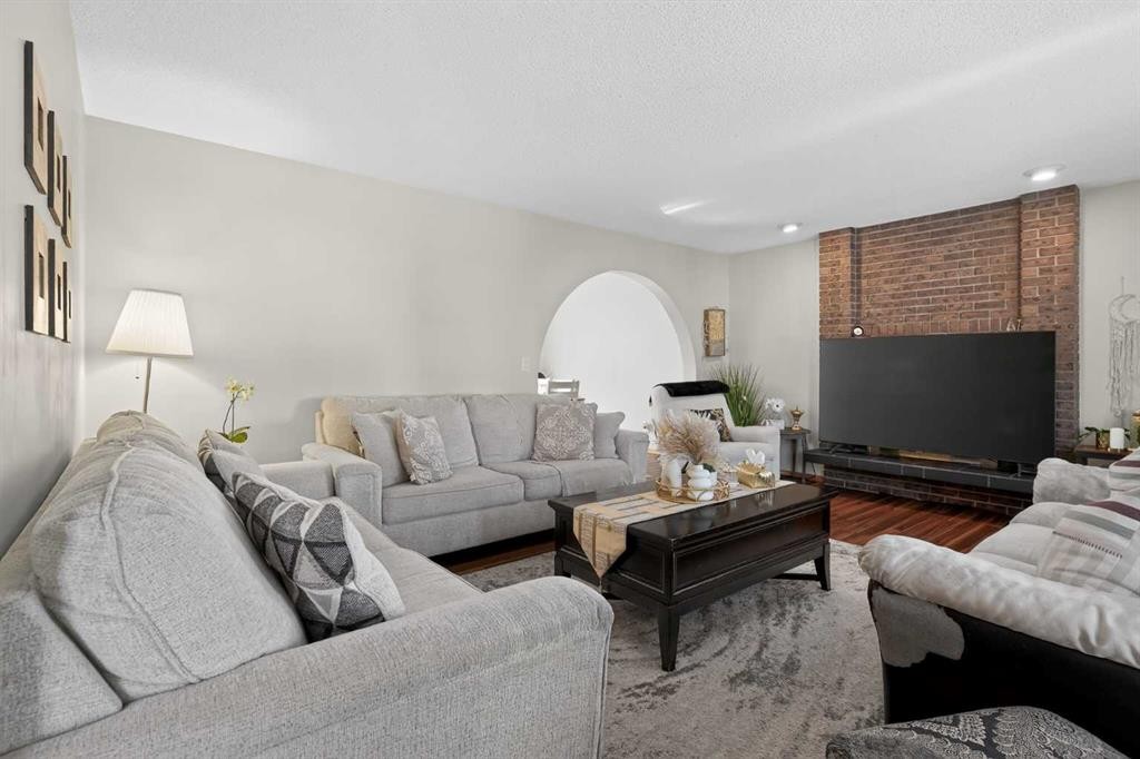 247 Templewood Road Ne, Calgary, AB - Indoor Photo Showing Living Room With Fireplace