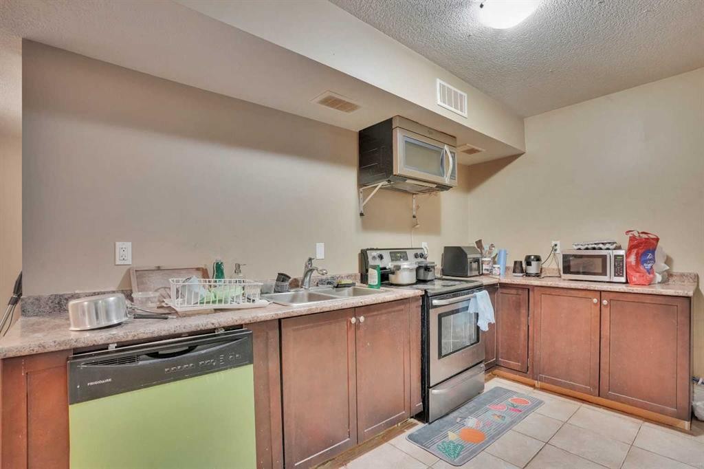 9 Saddlelake Grove Ne, Calgary, AB - Indoor Photo Showing Kitchen With Double Sink
