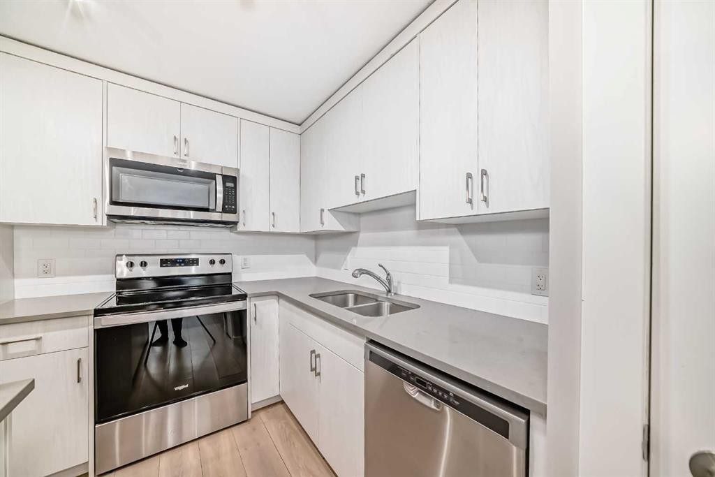 647 Cranbrook Walk Se, Calgary, AB - Indoor Photo Showing Kitchen With Stainless Steel Kitchen With Double Sink