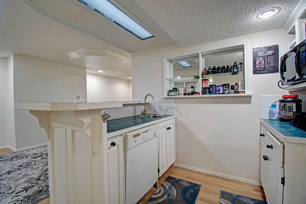 10316 Hidden Valley Drive Nw, Calgary, AB - Indoor Photo Showing Kitchen With Double Sink