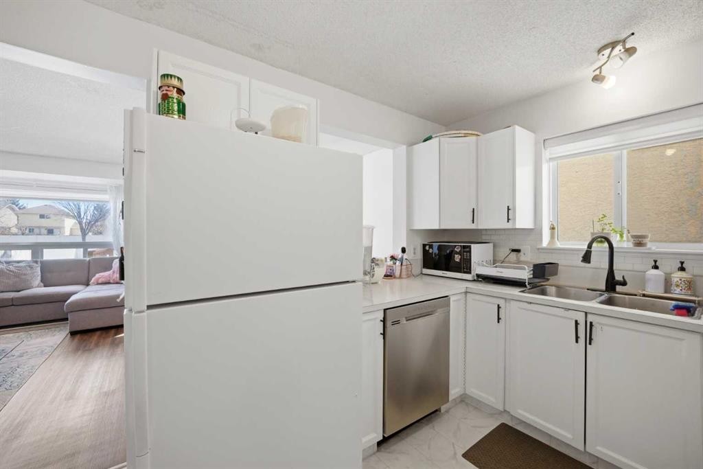80 Martinglen Way Ne, Calgary, AB - Indoor Photo Showing Kitchen With Double Sink