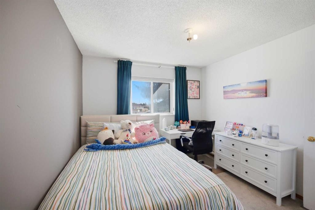 80 Martinglen Way Ne, Calgary, AB - Indoor Photo Showing Bedroom