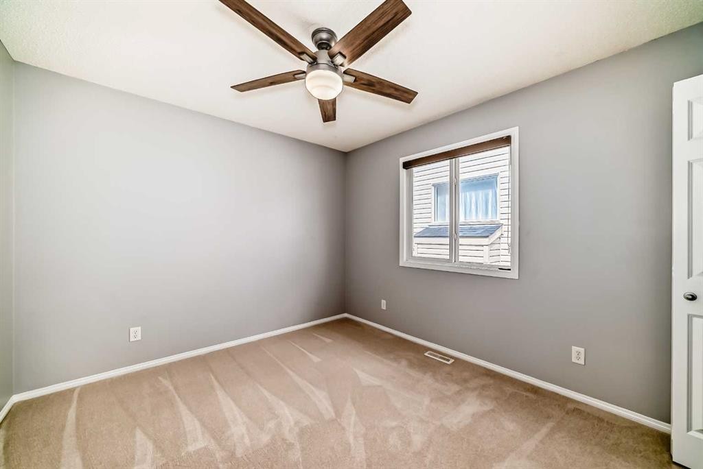46 Saddlecrest Gardens Ne, Calgary, AB - Indoor Photo Showing Other Room