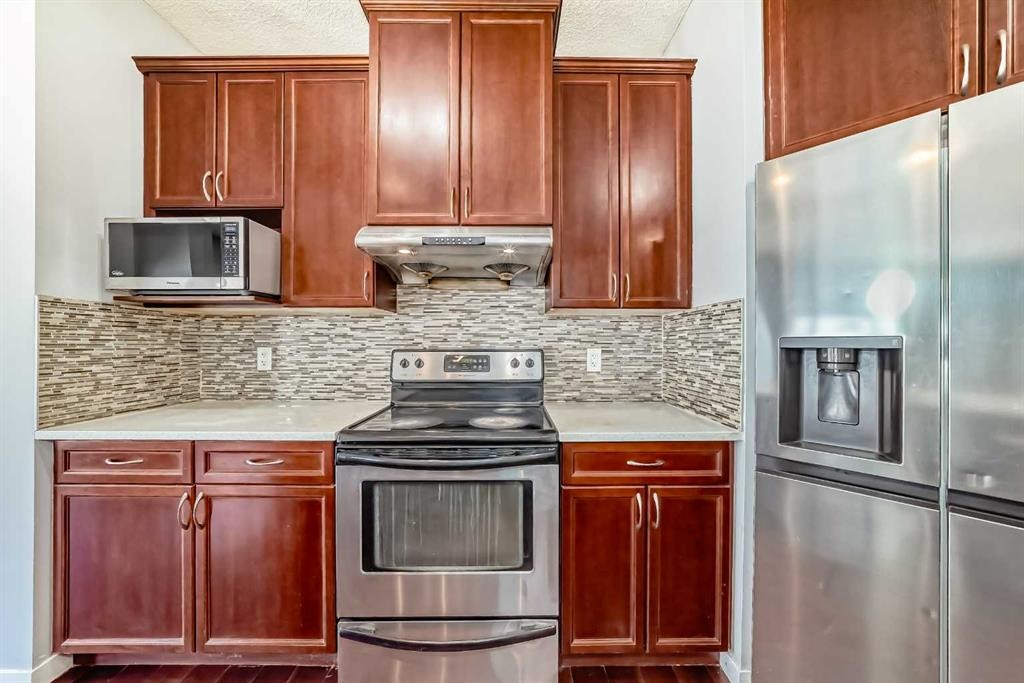 46 Saddlecrest Gardens Ne, Calgary, AB - Indoor Photo Showing Kitchen With Stainless Steel Kitchen