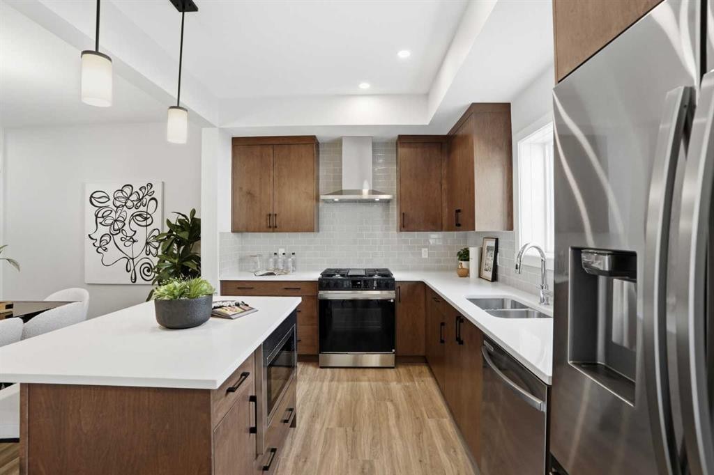 72 Buffaloberry Manor Se, Calgary, AB - Indoor Photo Showing Kitchen With Double Sink With Upgraded Kitchen
