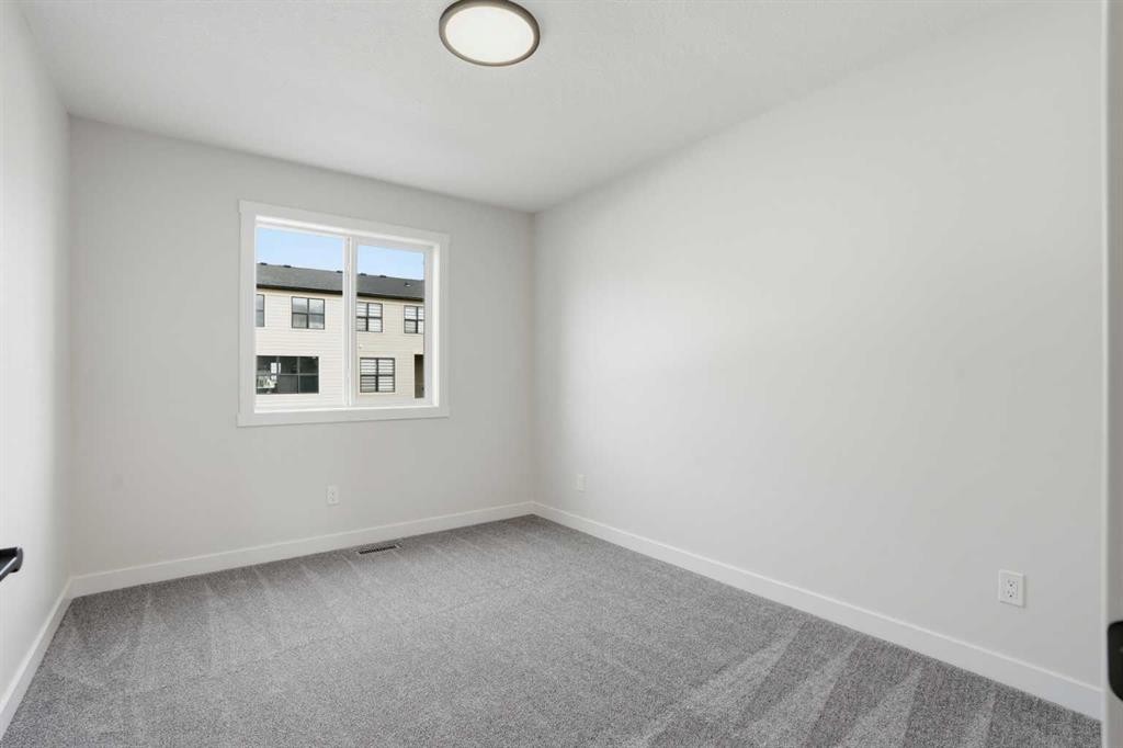 72 Buffaloberry Manor Se, Calgary, AB - Indoor Photo Showing Other Room