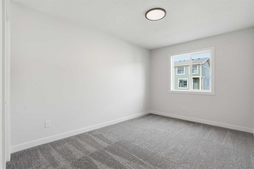 72 Buffaloberry Manor Se, Calgary, AB - Indoor Photo Showing Other Room