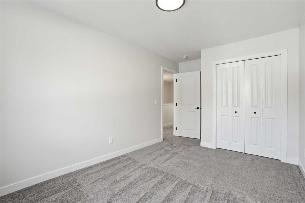 72 Buffaloberry Manor Se, Calgary, AB - Indoor Photo Showing Other Room