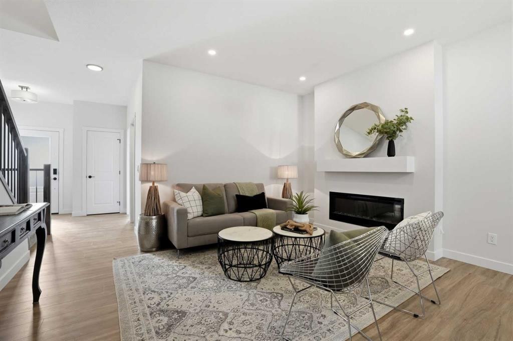 72 Buffaloberry Manor Se, Calgary, AB - Indoor Photo Showing Living Room With Fireplace