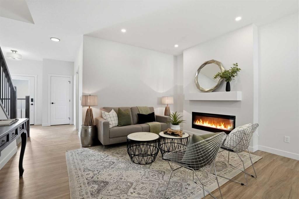 72 Buffaloberry Manor Se, Calgary, AB - Indoor Photo Showing Living Room With Fireplace