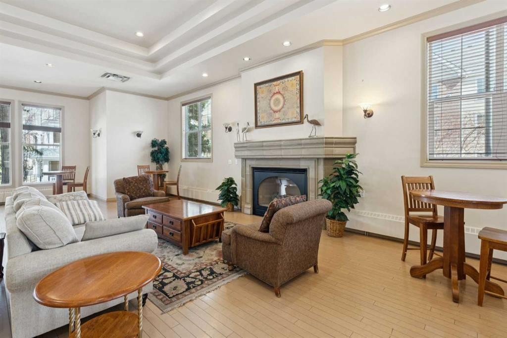 106-3650 Marda Link Sw, Calgary, AB - Indoor Photo Showing Living Room With Fireplace