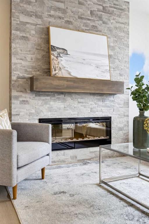 67 Versant Way Sw, Calgary, AB - Indoor Photo Showing Living Room With Fireplace