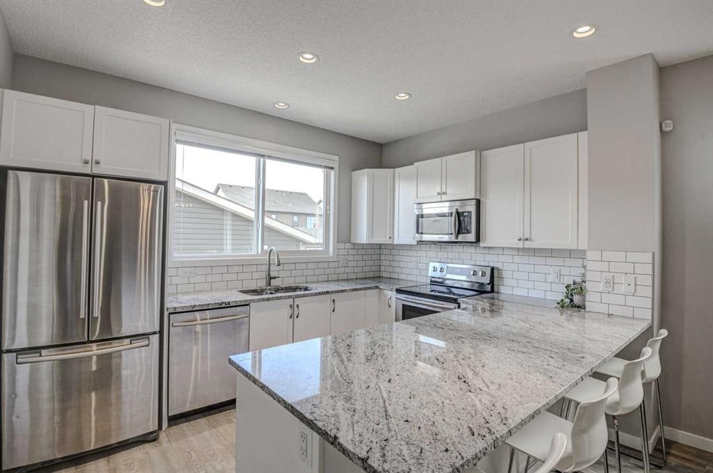 52 Masters Link Se, Calgary, AB - Indoor Photo Showing Kitchen With Upgraded Kitchen