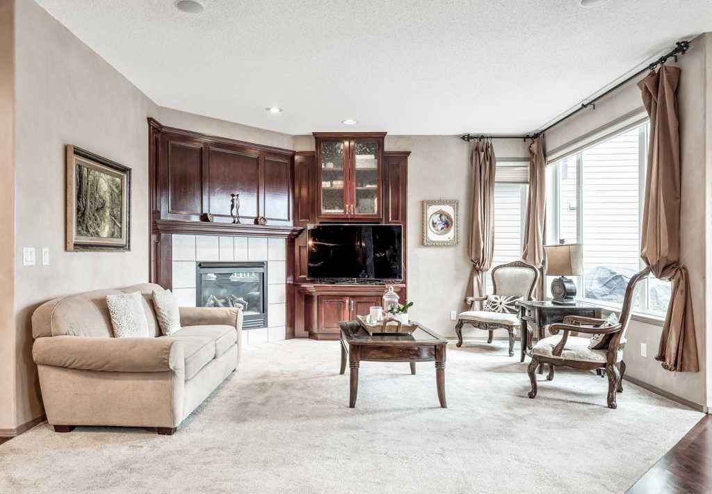 40 Cougar Ridge Heights Sw, Calgary, AB - Indoor Photo Showing Living Room With Fireplace