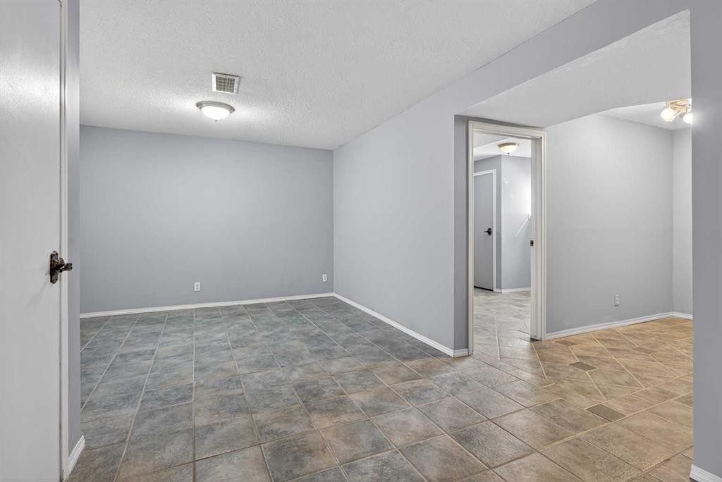 32 Fallingworth Court Ne, Calgary, AB - Indoor Photo Showing Other Room