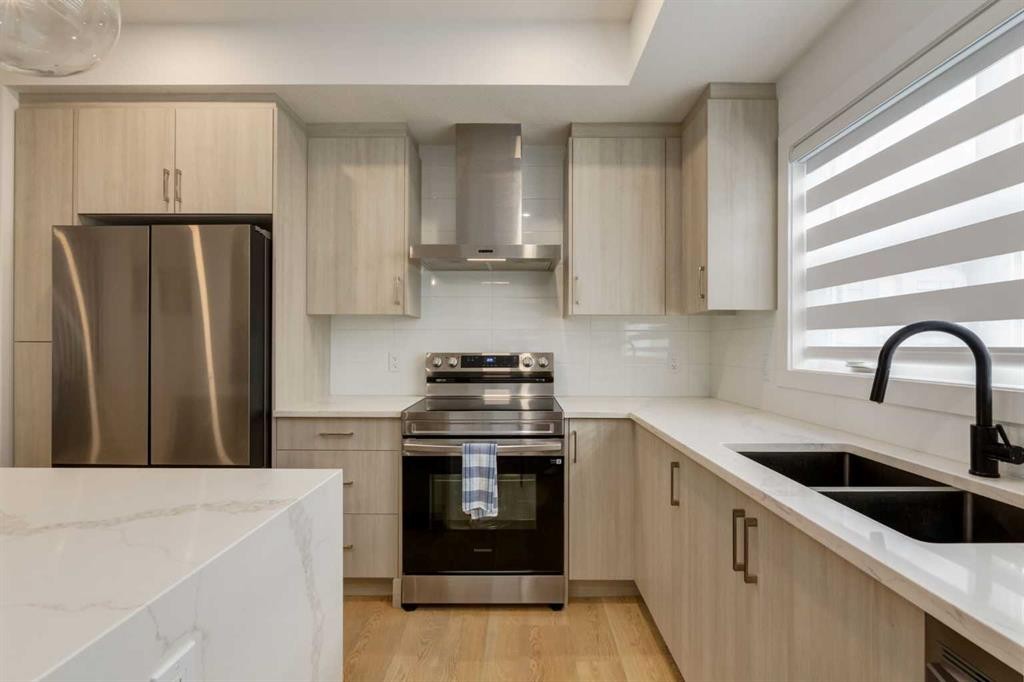 94-903 Mahogany Boulevard Se, Calgary, AB - Indoor Photo Showing Kitchen With Stainless Steel Kitchen With Double Sink