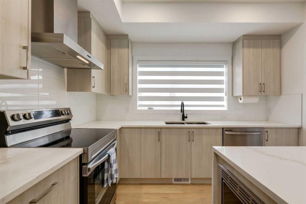 94-903 Mahogany Boulevard Se, Calgary, AB - Indoor Photo Showing Kitchen With Stainless Steel Kitchen With Double Sink