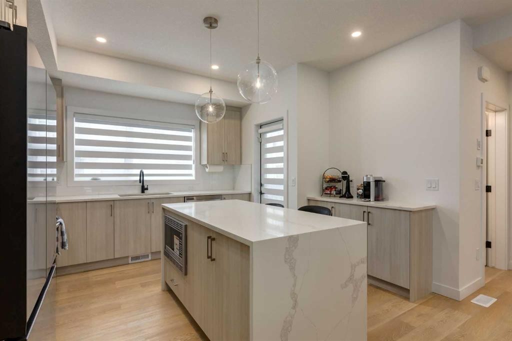 94-903 Mahogany Boulevard Se, Calgary, AB - Indoor Photo Showing Kitchen With Upgraded Kitchen