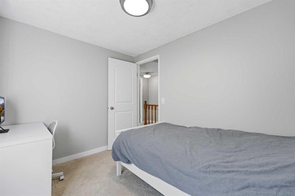 6 Mckernan Place Se, Calgary, AB - Indoor Photo Showing Bedroom
