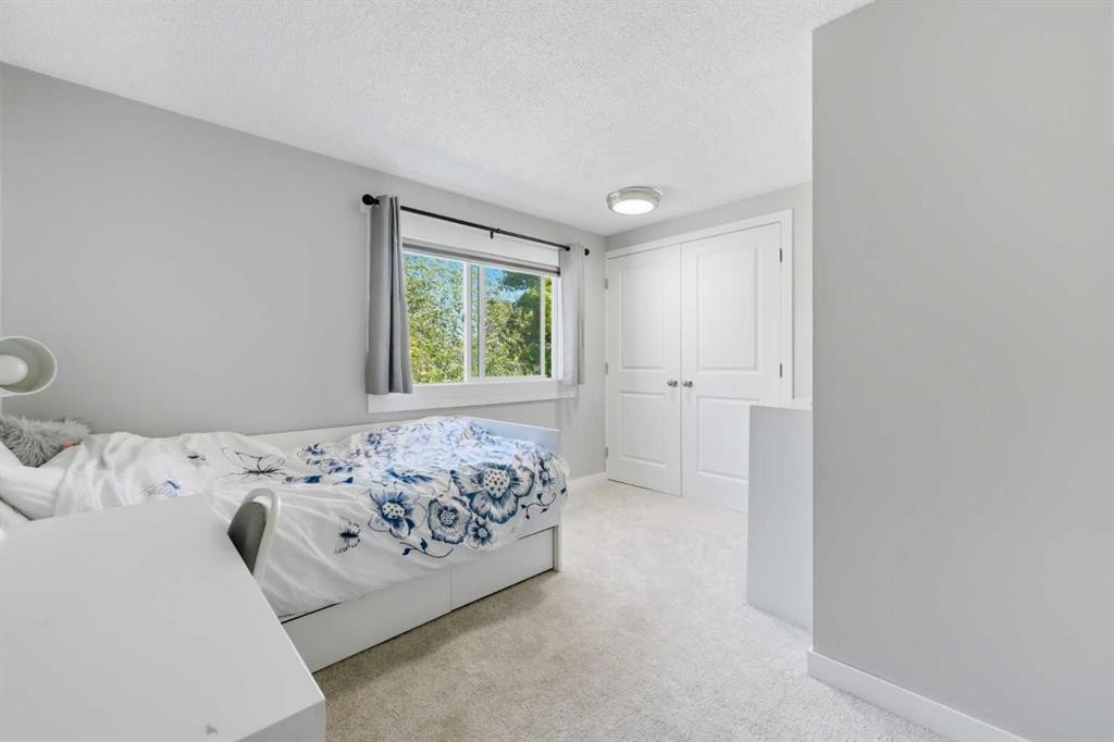 6 Mckernan Place Se, Calgary, AB - Indoor Photo Showing Bedroom