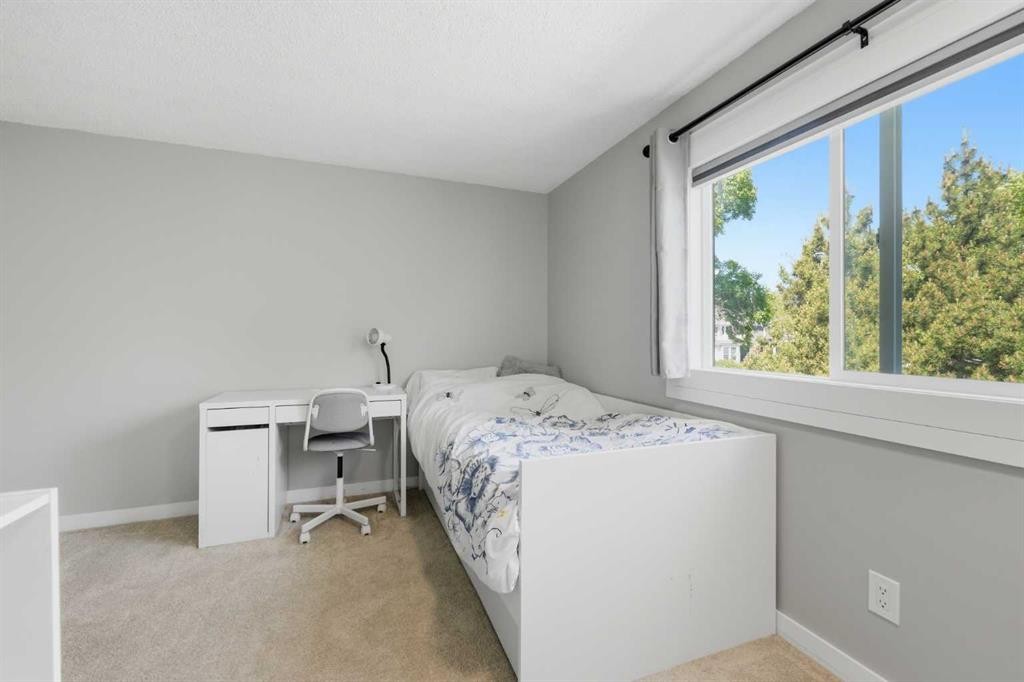 6 Mckernan Place Se, Calgary, AB - Indoor Photo Showing Bedroom