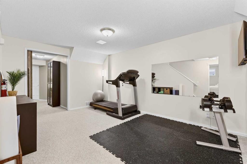 60 Inverness Drive Se, Calgary, AB - Indoor Photo Showing Gym Room